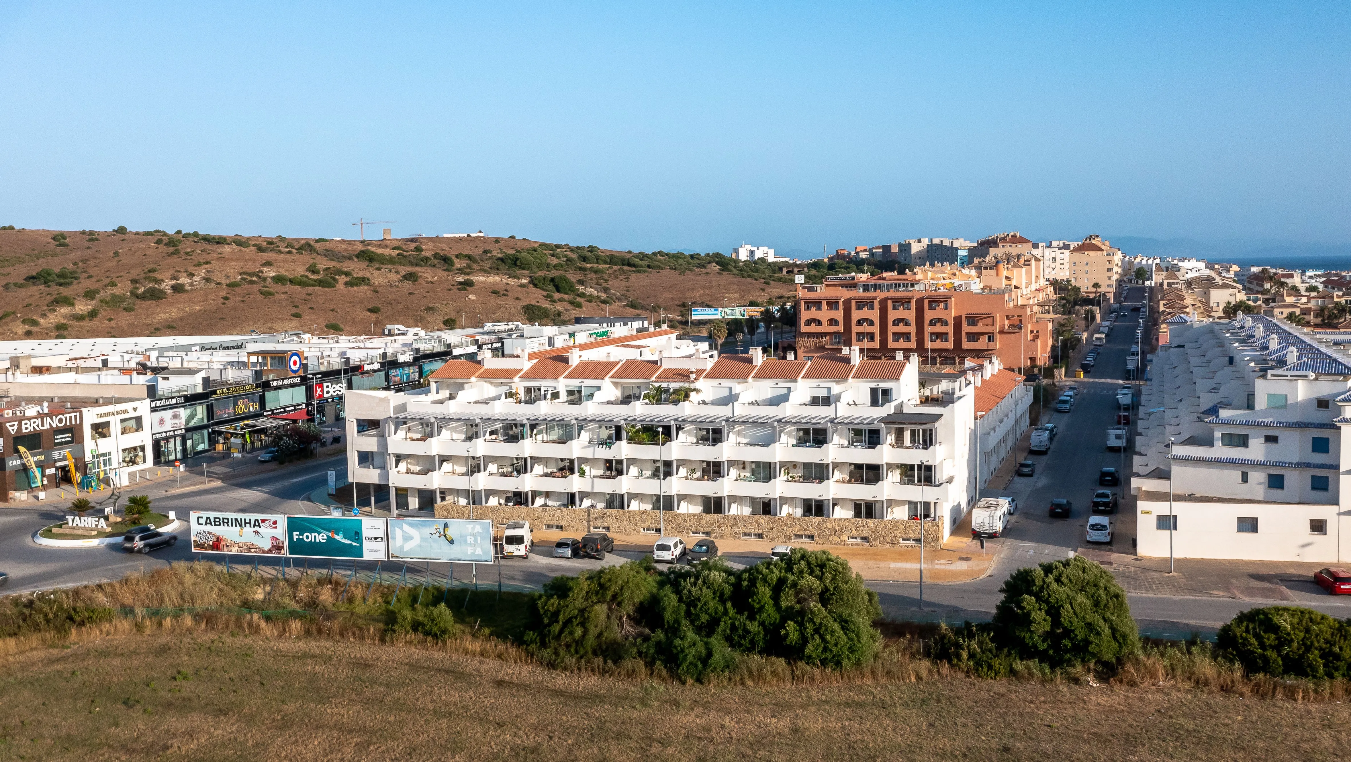 The apartment block, with the kite shops across the road