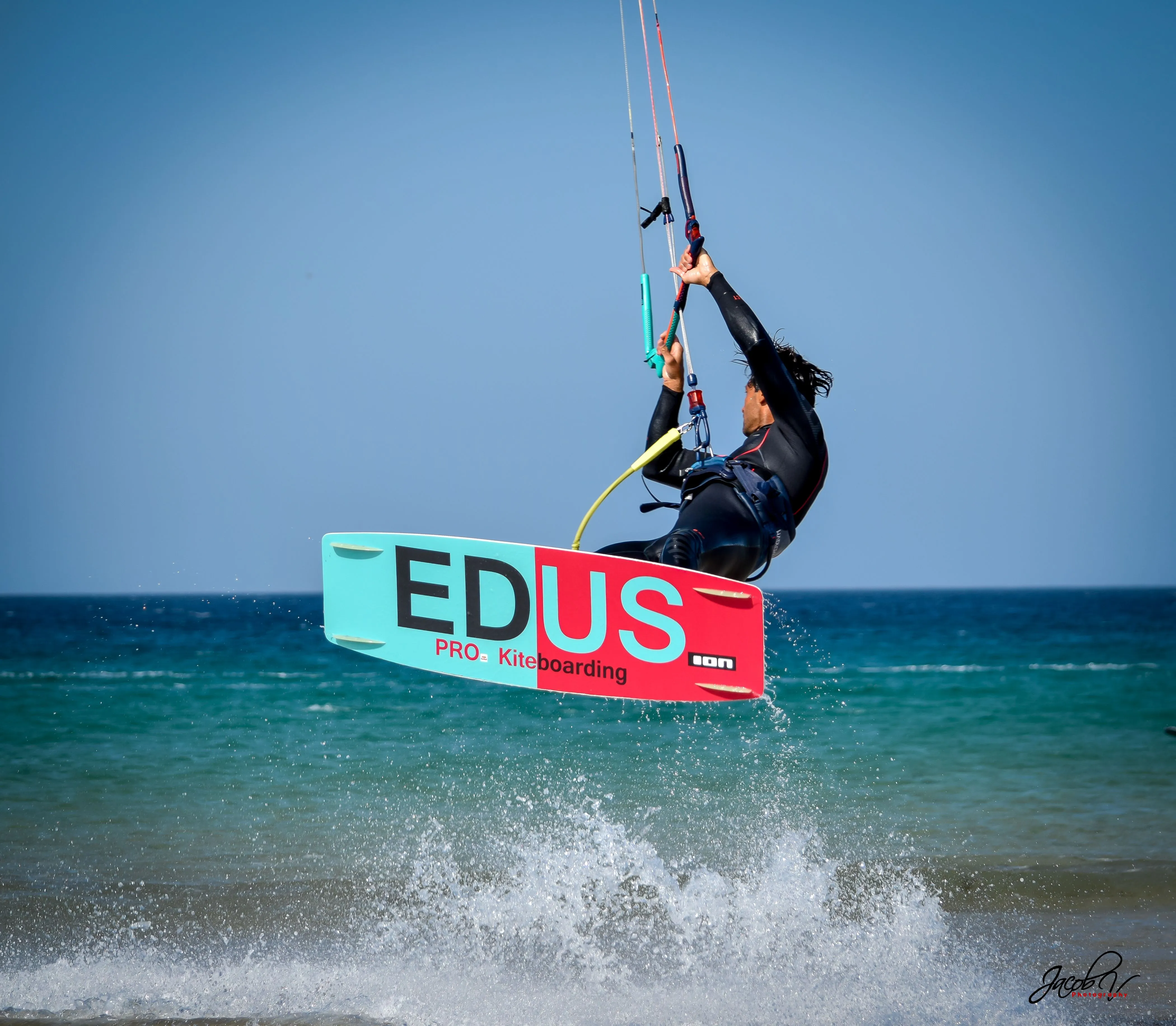 Kitesurfer jumping in front of the beach in Tarifa